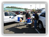 People by a table with coolers and snacks