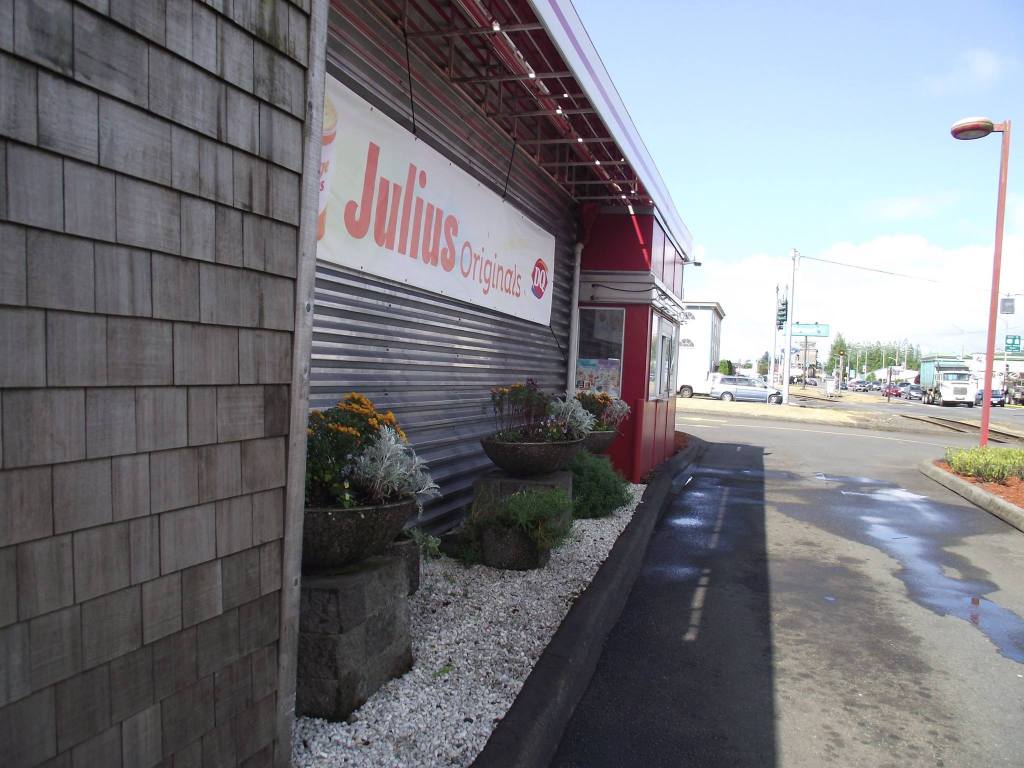 Flowers planted near metal door at Dairy Queen